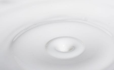 a drop splash of withe liquid or milkの写真素材