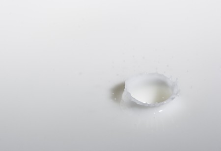 a drop splash of withe liquid or milkの写真素材