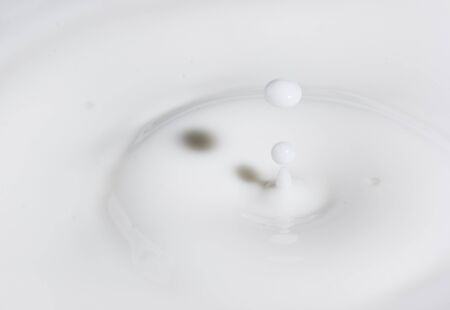a drop splash of withe liquid or milkの写真素材