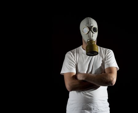 a man wearing a gas mask environment danger concept imageの写真素材