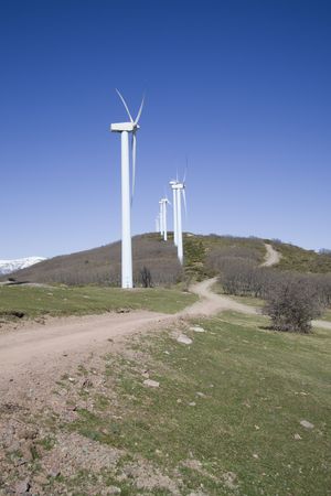 wind turbines renewable power over a blue sky 