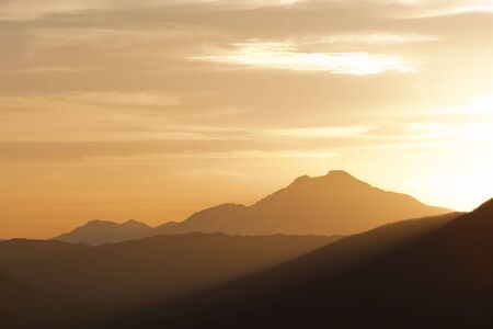 sunset scenic of a mountain range in the natureの写真素材