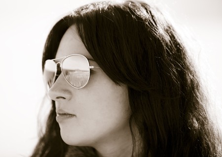 beautiful brunete girl with the sea as the backgroundの写真素材