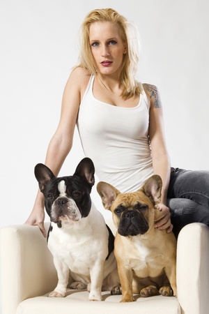 a sexy attractive blond woman with a small french bulldogの写真素材