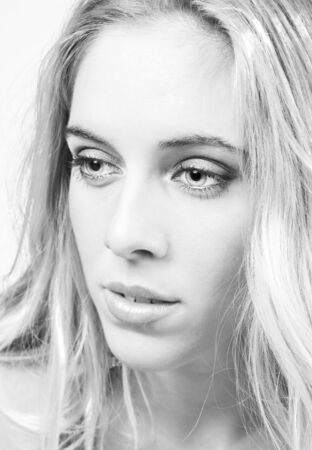 a portrait of a real beautiful young surprised girlの写真素材