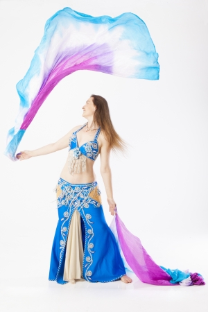 woman with curves dancing an oriental dance belly dancerの写真素材