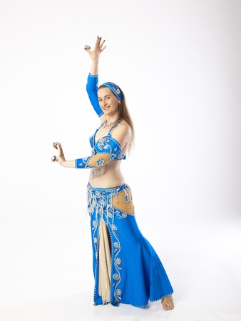 woman with curves dancing an oriental dance belly dancerの写真素材