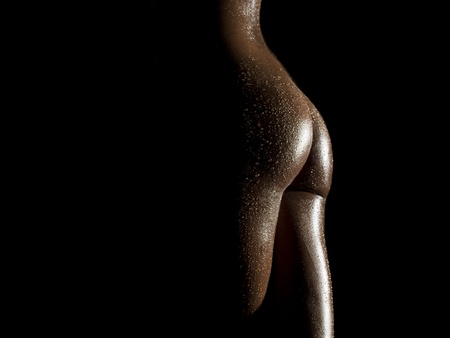 sexy female body shapes and curves over a dark backgroundの写真素材