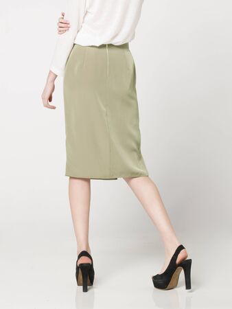 a beautiful model wearing feminine clothes in clear backgroundの写真素材