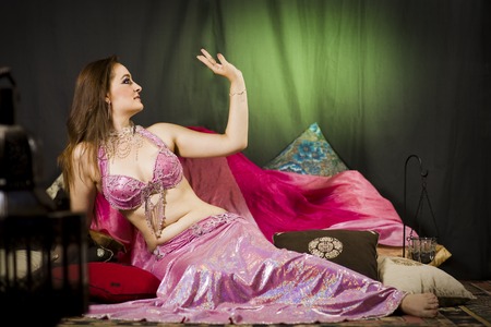 beautiful woman dancing the oriental style dance called belly danceの写真素材