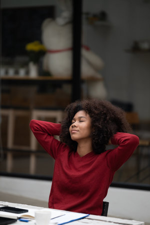 American African Woman working with computer phone and Tablet outdoor.の写真素材