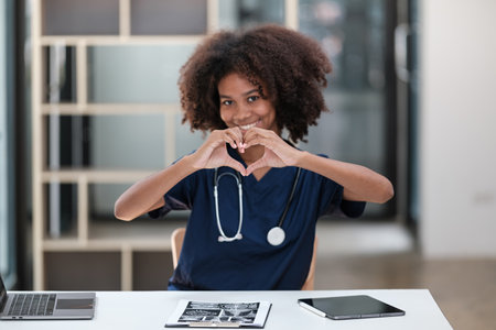 Portrait of female African American doctor with Stethoscope in her office at clinic.の写真素材
