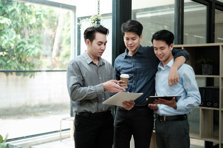 Group of business man discussion and brainstorming, bookkeeping audit graph and chart in tablet,...