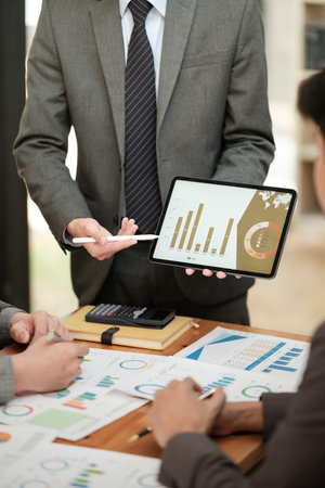 View of a Boss heading a business on the Tablet with partners.の写真素材