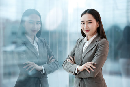 A woman in a business suit is posing for a picture