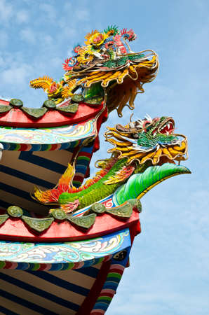 Colorful chinese dragon on rooftop の写真素材