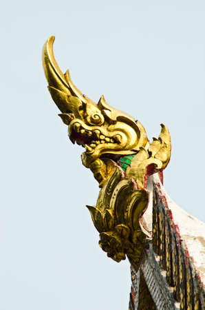 Thai dragon on temple rooftop の写真素材