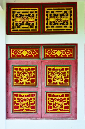 Old window of chinese temple の写真素材