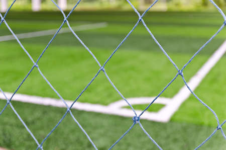 Empty field and the netの写真素材