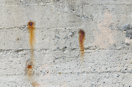 Old rusty steel in cement wall for backgroundの写真素材