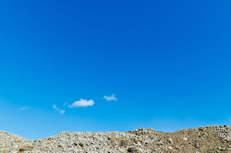 Blue sky with gray stone