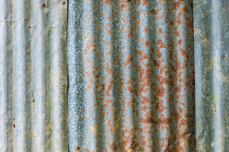 Rusty and old zinc plate wall closeup for backgroundの写真素材
