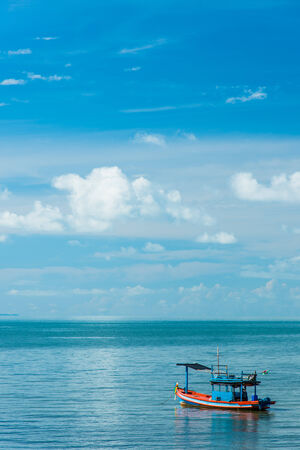 Small boat with blue skyの写真素材