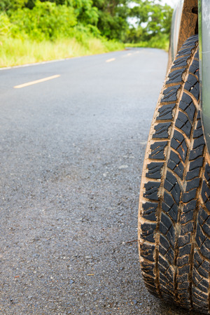 Closeup dirty wheel with nature backgroundの写真素材