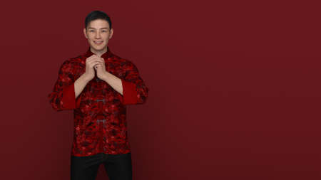 3D Render : Portrait of young Asian man in traditional Changshan chinese dress with gesture of congratulation on chinese new year day isolated on red background, happy Chinese new year conceptの写真素材