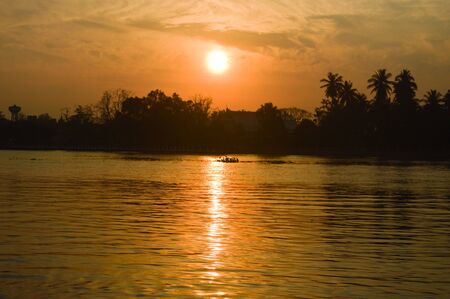 The sun was falling beyond the horizon.の写真素材