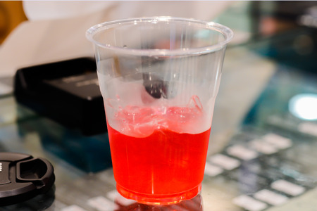 Sweet red juice in clear glass.の写真素材
