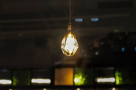 Light bulb in a dark place.の写真素材