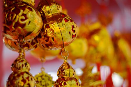 Chinese new year festival decorations, ang pow or red firecracker and gold ingots,items used in the belief that the good luck and wealthの写真素材