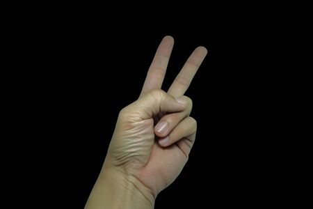 Hands-on background, 
Hand-made symbol of the struggle ,
Holds two fingersの写真素材