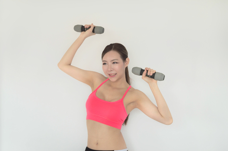 portrait of young fitness woman and 
exerciseの写真素材