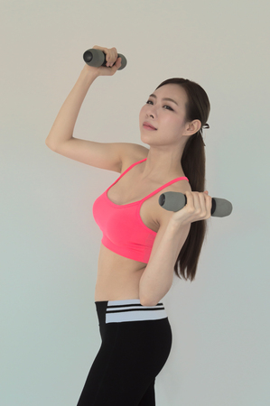 portrait of young fitness woman and 
exerciseの写真素材