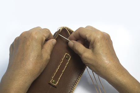 blurred photo, Blurry image,The stitched leather bags by hand,backgroundの写真素材