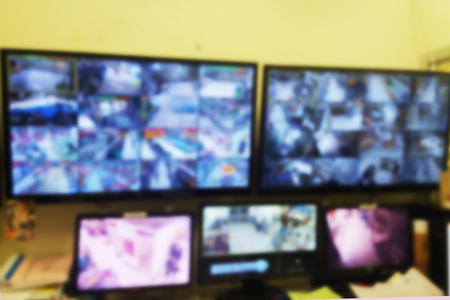 blurred photo, Blurry image, closed circuit camera,security system walkie-talkie while looking at CCTV footage.の写真素材