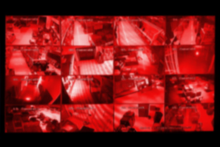 blurred photo, Blurry image, closed circuit camera,security system walkie-talkie while looking at CCTV footage.の写真素材