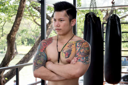 Boxing men with floating tattoo show muscles.の写真素材