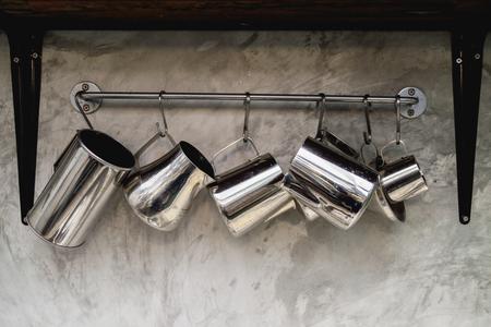 Stainless steel pots  isolated hang on  backgroundの写真素材