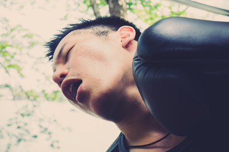 Close up portrait of boxer getting knocked outの写真素材