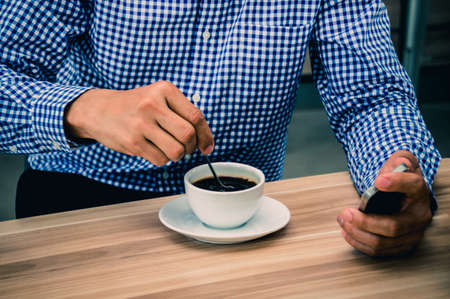 Men are making hot coffee ready to drink at the table.の写真素材