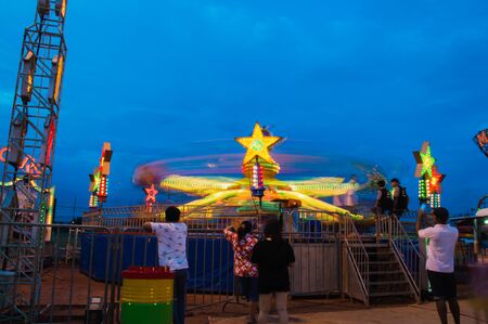Samutsakhon, Thailand - July 30, 2017: People go to play amusement park outside the city.のeditorial素材
