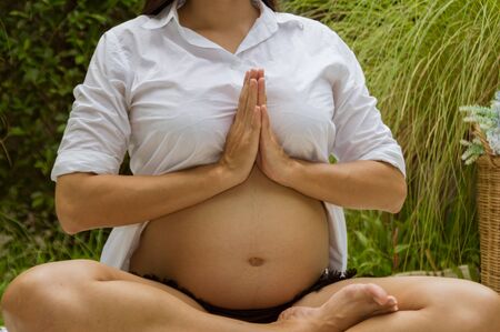 Abdominal women are taking care of their health with yoga.の写真素材