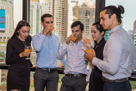 Youngs business people are celebrating success.