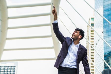 Young businessmen look good on the outside background.の写真素材