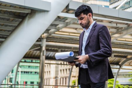 Young businessmen look good on the outside background.の写真素材