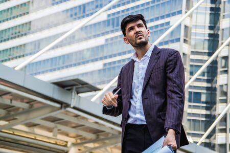 Young businessmen look good on the outside background.の写真素材