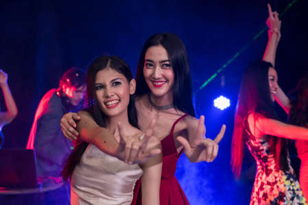 Young people are celebrating the night party entertainment.の写真素材